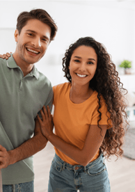 Young couple at the entrance to their home