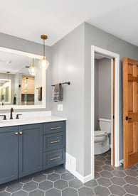 Bright bathroom remodel with updated lighting and stylish tile work