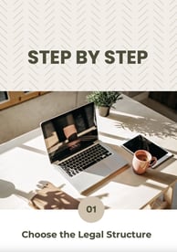 a laptop computer on a table with a cup of coffee and a plant