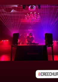 around a dj booth at a nightclub with instagram tag for creechur
