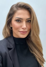 a woman with long hair and a black jacket