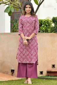 Palazzo pants paired with kurtas create a breezy, graceful ensemble. The flowy bottoms balance out b