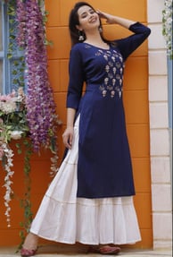 A fusion favorite, skirt-kurta combos are ideal for festivals and weddings. The long flared skirt ad