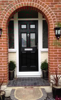 a black front door 2 panel 2 square glass with side panels