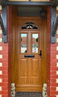 wood coloured new composite front door fitted in Hampshire