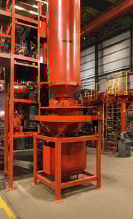 a large red metal structure with a red and black metal structure