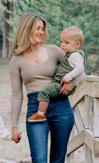an adoption consultant woman holding a baby in her arms