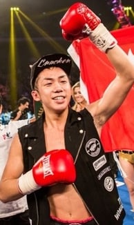 Photo of Hong Kong boxer Rex Tso in front of a Hong Kong flag