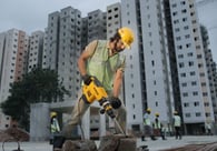 man in yellow helmet with drill machine at construction site, ONE FOR LOVE, AD FILM, Aditya Satyajit