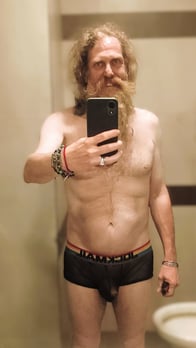 Axel TheBeast posing for a mirror selfie