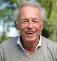 an older man with a smile on his face