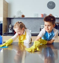 children helping clean the kitchen