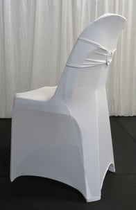 White pippee plastic chair dressed in a white spandex cover with matching bling ribbon, for hire in Brisbane.