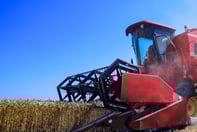 a red tractor with a red tractor in the background