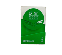 a green box of tea bags with a green leaf