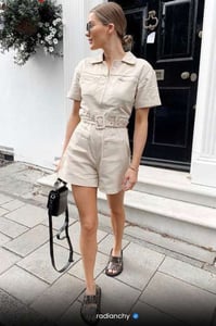 a woman in a short sleeved shirt and shorts