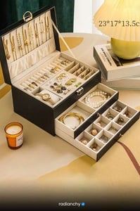 a jewelry box with a candle and a candle