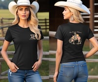 a woman wearing a cowboy hat and jeans