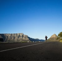 a person riding a skateboard down a hill