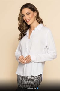a woman in a white shirt and checkered pants