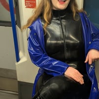 FTSH Studios model (s) Shannon Huxley UK Fetish Model in Latex Catsuit and Blue PVC Raincoat in London on the Underground