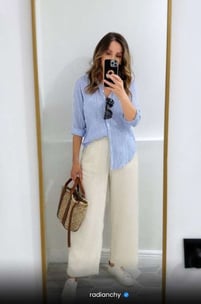 a woman taking a selfie of herself in a mirror