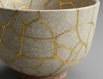 Mended ceramic bowl, symbolizing wholeness and natural resilience