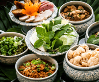 a variety of asian food in bowls