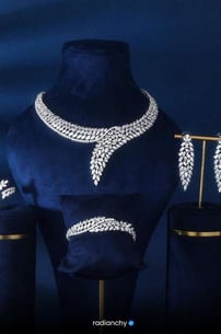 a necklace and earrings set with a necklace and earrings