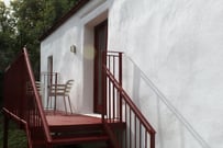 A private balcony with seating