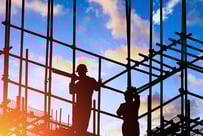 a man standing on a scaffold of scaffolding