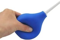 a person holding a blue plastic object in their hand