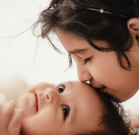 Adorable baby smiling during a professional photoshoot at Vidaychandra Photostudio
