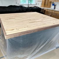 Handcrafted epoxy bar top with a unique resin design, adding a stylish and durable focal point to any entertainment space.