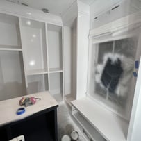 Professionally refinished white closet in Phoenix, featuring a smooth, modern finish for a fresh and updated look."