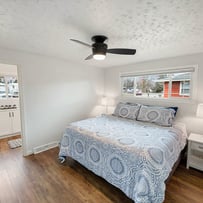 Professional photograph of a new and clean bedroom design.