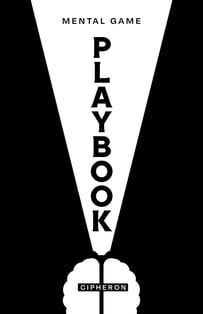 a man's hand holding a book with a white light bulb on it