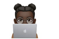 a person sitting at a desk with a laptop