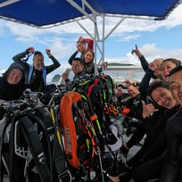 group photo of divers on a boat