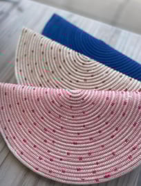 a pair of straw hat with polka dot dots on it