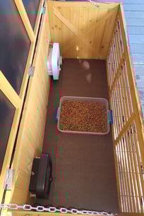 Inside view of feeder showing covering on floor.