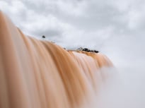 a waterfall with a few trees and a few trees