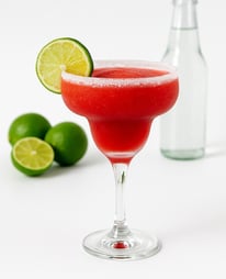 Red Sparkling beverage with lime
