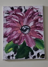a painting of a flower on a white wall
