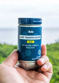 picture of transfer factor plus bottle in my hand