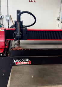 Our machine that is cutting into a piece of metal