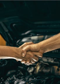 Our skilled mechanics shaking hands, symbolizing trust and professionalism in every service