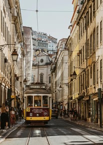 a trolley car on a city street in a city
