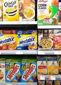 a variety of cereals on display in a store