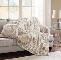 a couch with a blanket on it